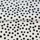 Stenzo: zwarte nopjes op wolwitte katoen