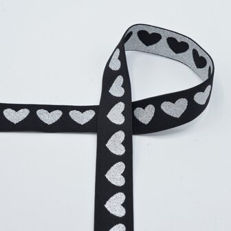 taille-elastiek 2,5 cm breed: glanzende zilveren hartjes op zwart / HALVE METER