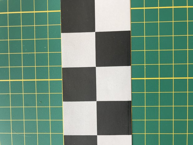 5 cm breed geweven band met ruitjes zwart-reflecterend zilverkleur