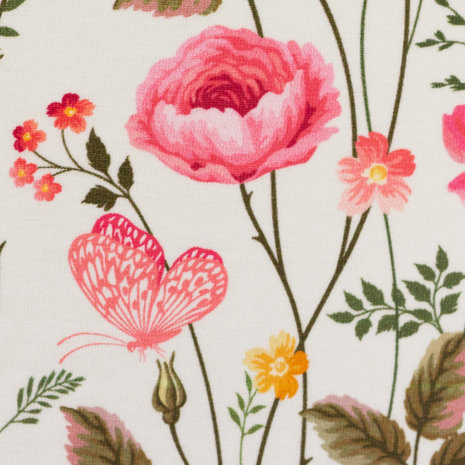 Henry: roze bloemen en blaadjes met hier en daar een vlindertje op wolwitte tricot