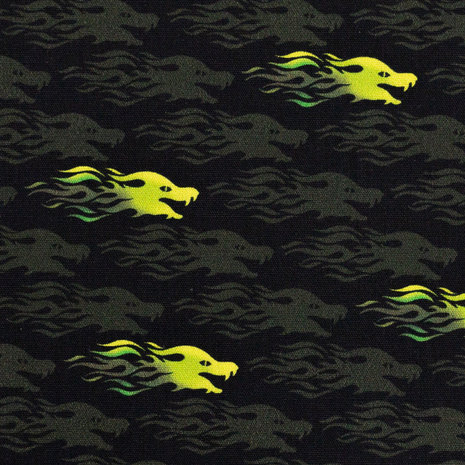 Mystic Dragons by Steinbeck: zwarte katoen met drakenkopjes in felle geel-groene kleuren. 