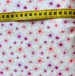 Tricot watercolorprint: suikerbloempjes op gebroken wit Tricot watercolorprint: suikerbloempjes op gebroken wit