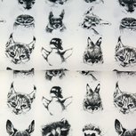 Stenzo: dierenkopjes in zwart op wolwitte katoen Stenzo: dierenkopjes in zwart op wolwitte katoen